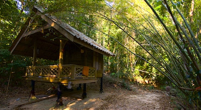 A Buddhist monk's hut or kuti in southern Thailand at Wat Suan Mokkh in Chaiya province.
